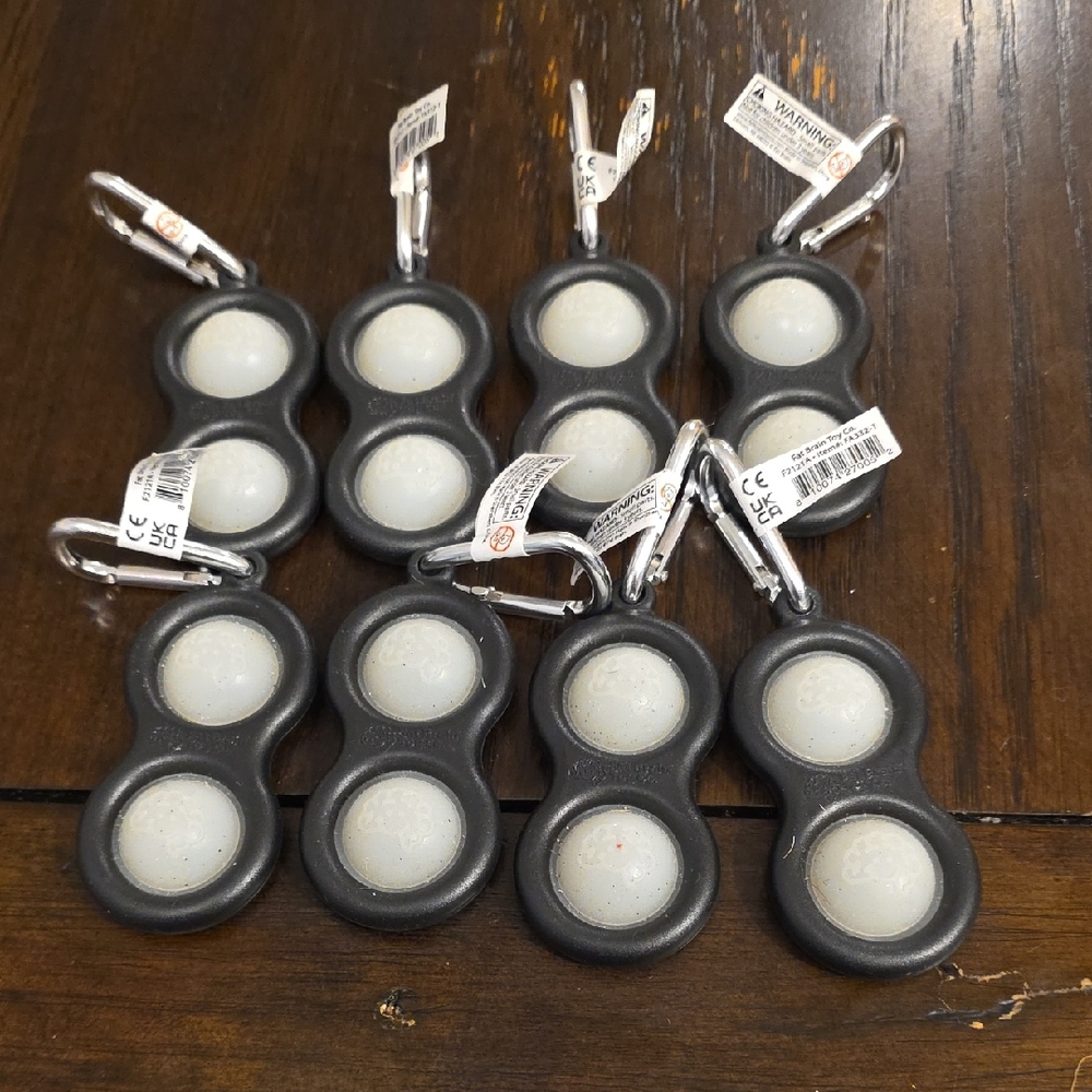 Simple Dimpl Glow-in-the-Dark Keychains. Set Of 8